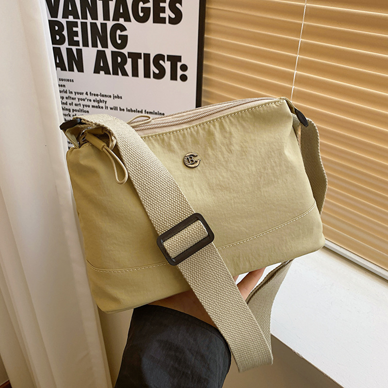 Minimalist Waterproof Lightweight Casual Fabric Unisex Fashion Commuter Three-Layer Large Capacity Shoulder Crossbody Bag ddmymoon