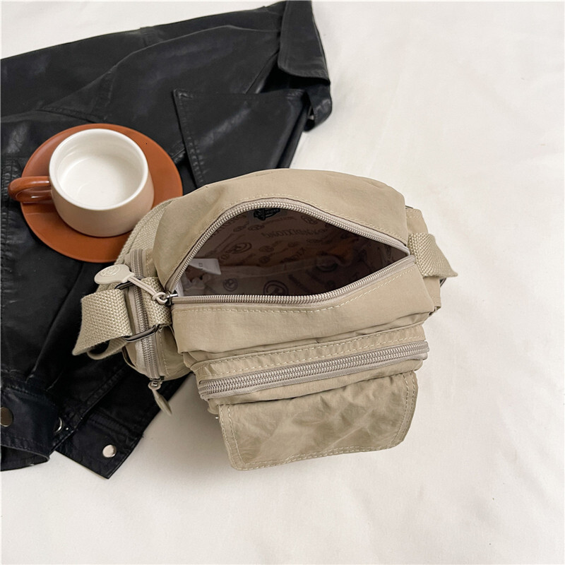 Hot Selling Waterproof Lightweight Nylon Women's New Outdoor Casual Shoulder Crossbody Multi-Pocket Camera Bag ddmymoon