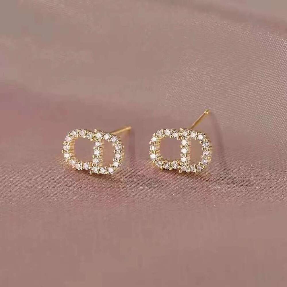 DHcollections Letter CD Ins Style Rhinestone Hollow Socialite Light S Pure Sier Needle Earrings for Women