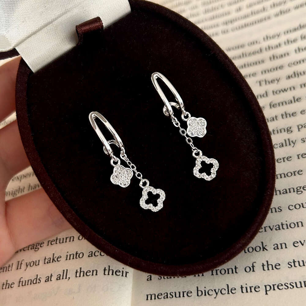 2025 Hot Luxury jewelry designer earrings with geometric hollow zirconia 4-leaf flower tassel earrings copper plated gold high-end light luxury earrin