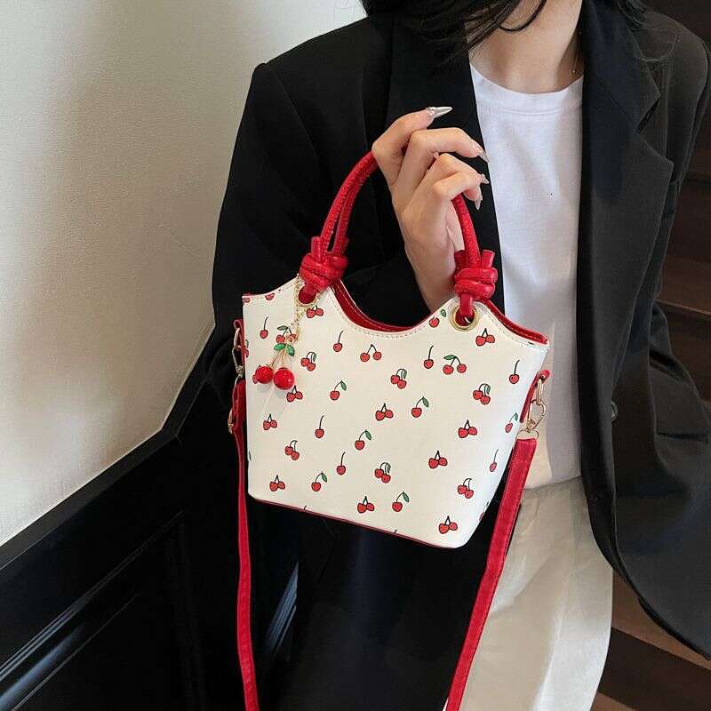 designer leisure Design 2025 New Trendy Fashion Cherry Print Crossbody Bucket Color-Block Texture Shoulder Bag