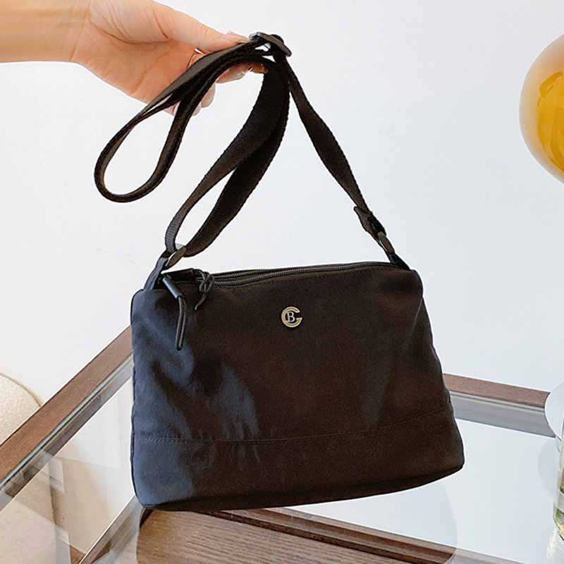 Minimalist Waterproof Lightweight Casual Fabric Unisex Fashion Commuter Three-Layer Large Capacity Shoulder Crossbody Bag ddmymoon