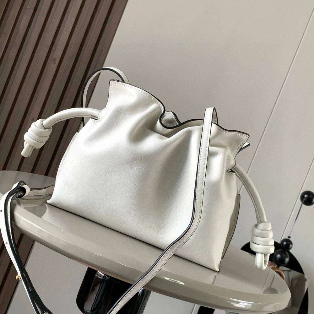 New real leather clutch fashion casual Joker slung shoulder solid color drawstring bucket advanced simple women bag