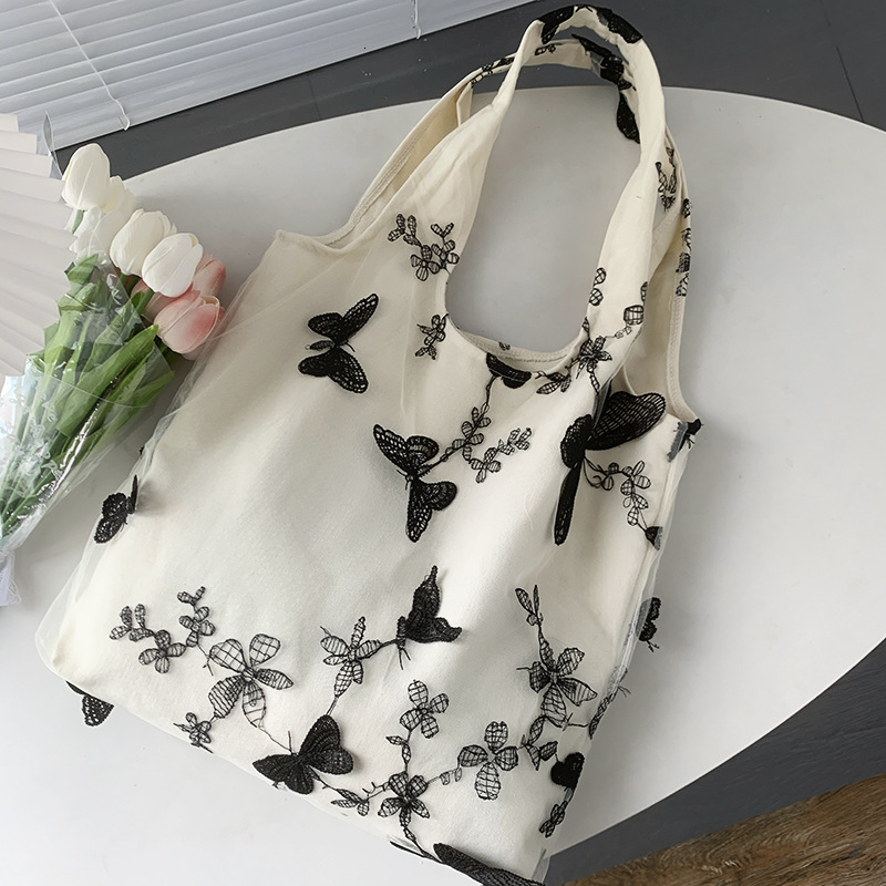 Autumn new embroidered black butterfly canvas bag lace casual travel women's shoulder bag niche design capacity women's crossbody bag Autumn