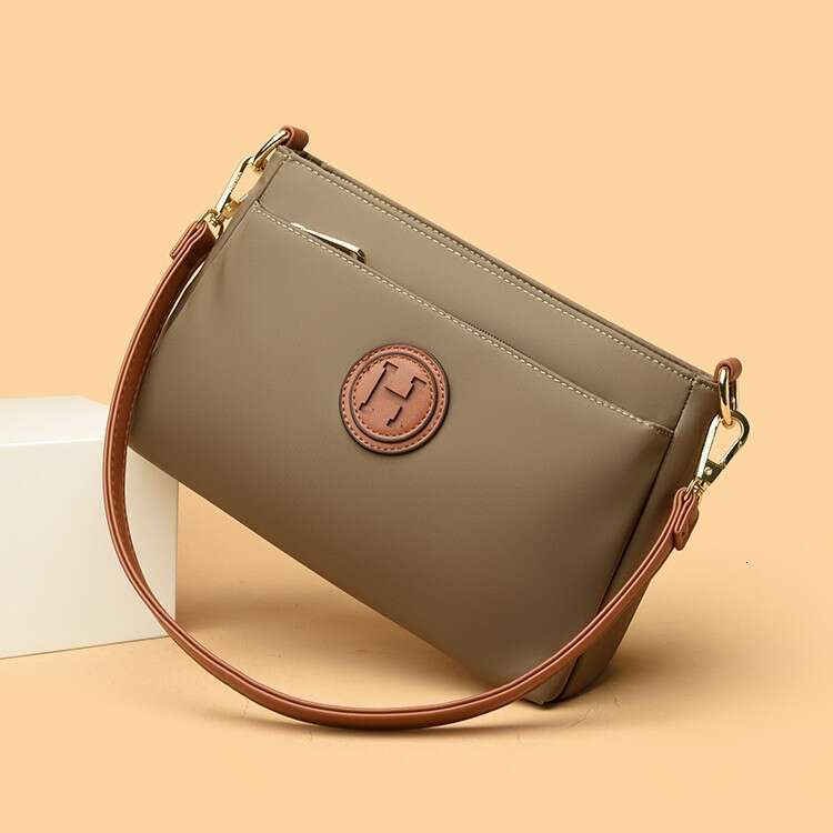 Commuting Women Zipper Shoulder Crossbody 2025 New Niche Design Artistic Canvas Stitched Postman Bag