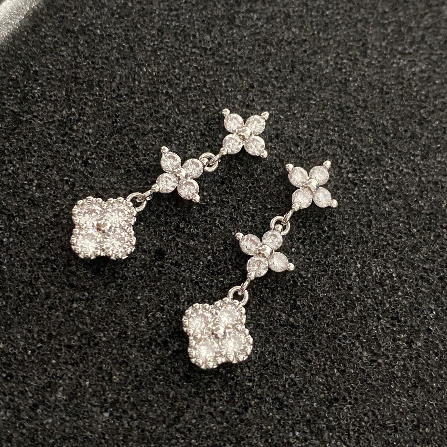 Multicolored gemstone flower - shaped earrings, possibly light luxury accessories from a fashion brand.