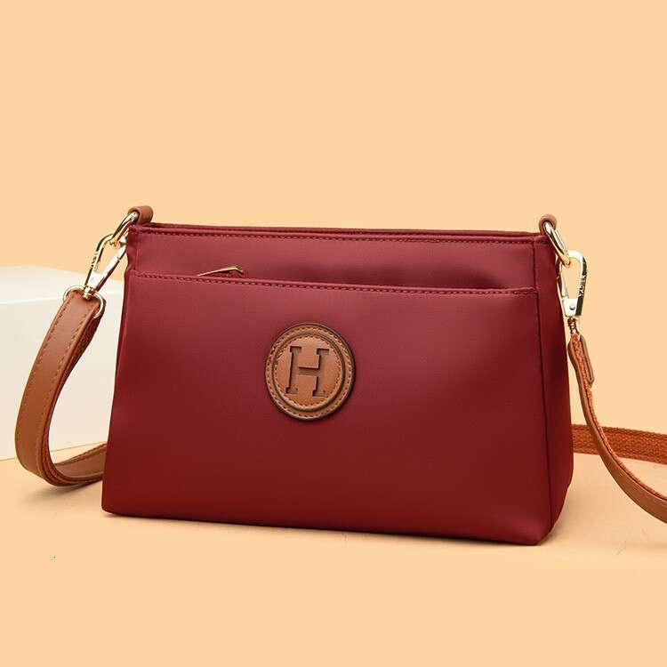 Commuting Women Zipper Shoulder Crossbody 2025 New Niche Design Artistic Canvas Stitched Postman Bag