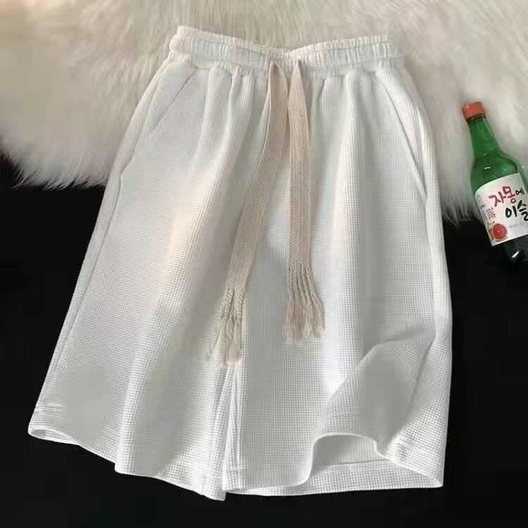 Shorts men's summer five-inch pants, loose fit, inspired by Korean style, versatile beach pants, suitable for wearing outside.