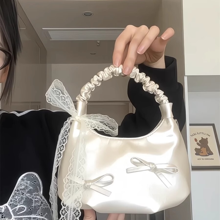 2025 New Women's Bow Underarm Bag Designer Casual Commuter Folded Dumpling Bun