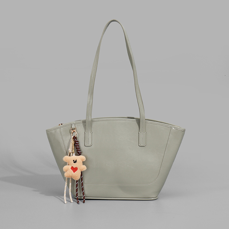 2025 Autumn New Women s Shoulder Bag Large Capacity Cute Pendant Women s Handbag Autumn New Commuter Bag Autumn New bag women s Simple Style Solid Col