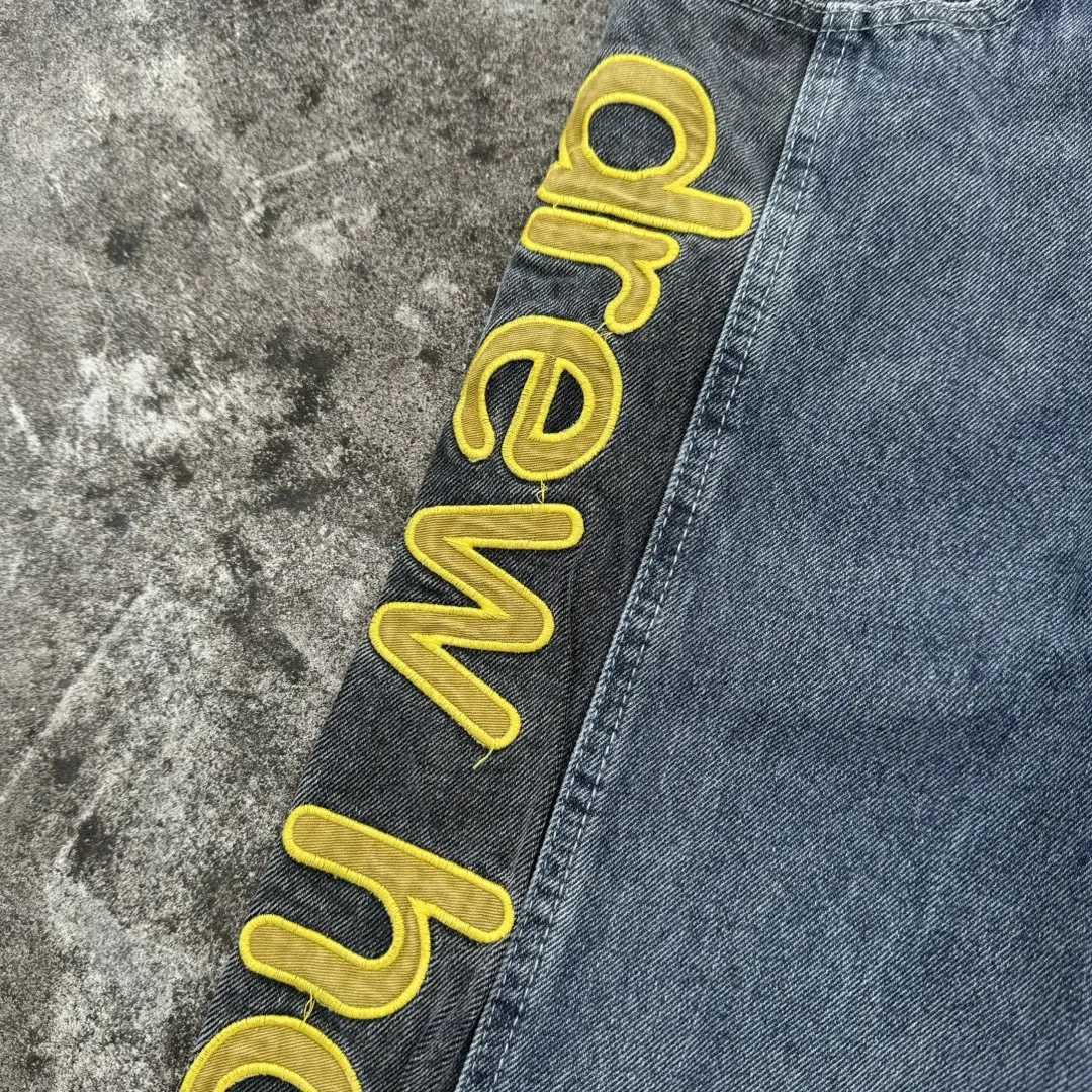 The denim fabric is stitched with a special style of patchwork design jeans for men and women casual mens clothing X250812