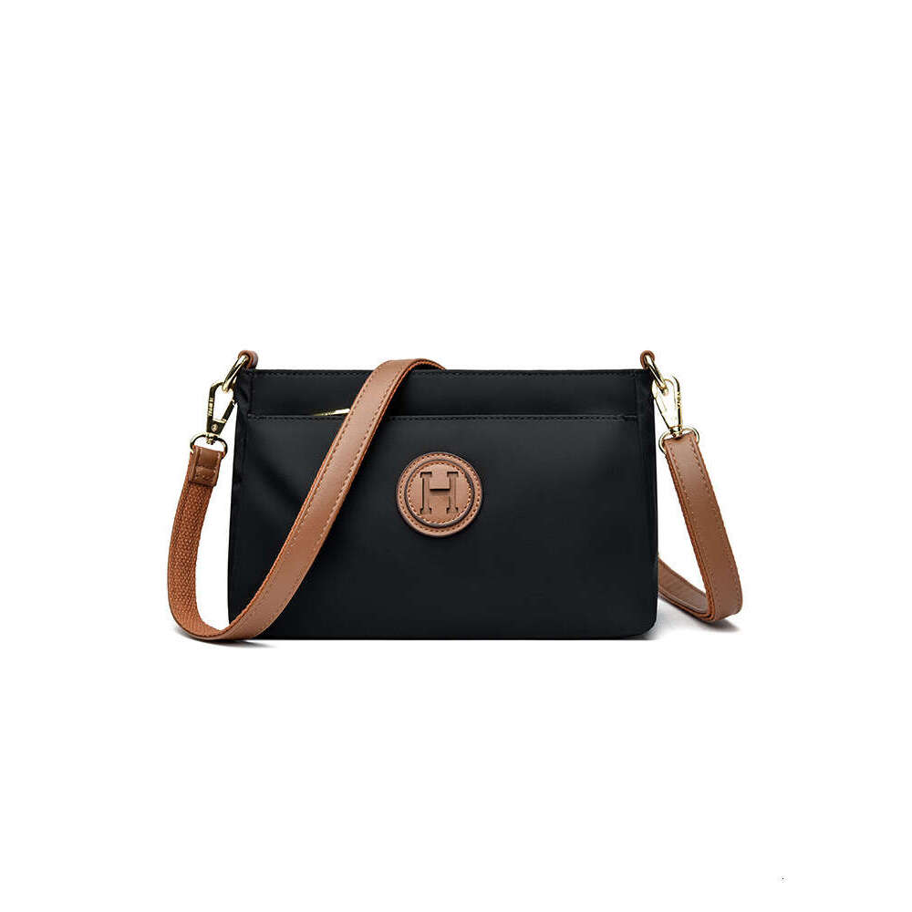 Commuting Women Zipper Shoulder Crossbody 2025 New Niche Design Artistic Canvas Stitched Postman Bag