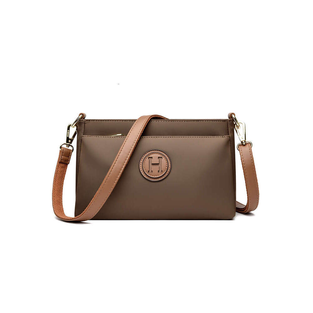 Commuting Women Zipper Shoulder Crossbody 2025 New Niche Design Artistic Canvas Stitched Postman Bag