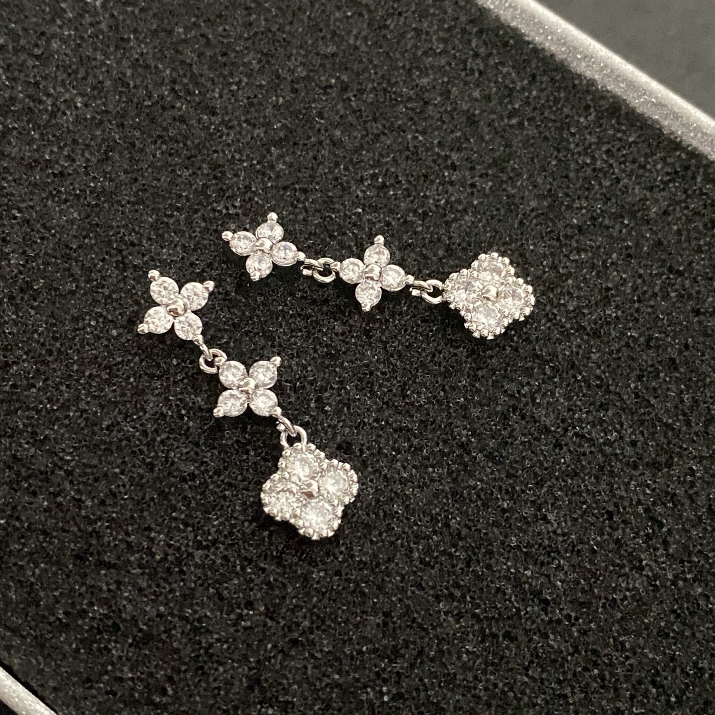 Multicolored gemstone flower - shaped earrings, possibly light luxury accessories from a fashion brand.