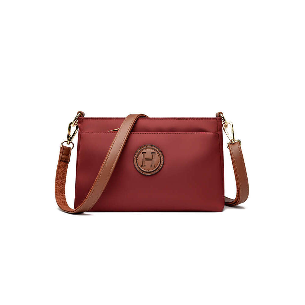 Commuting Women Zipper Shoulder Crossbody 2025 New Niche Design Artistic Canvas Stitched Postman Bag