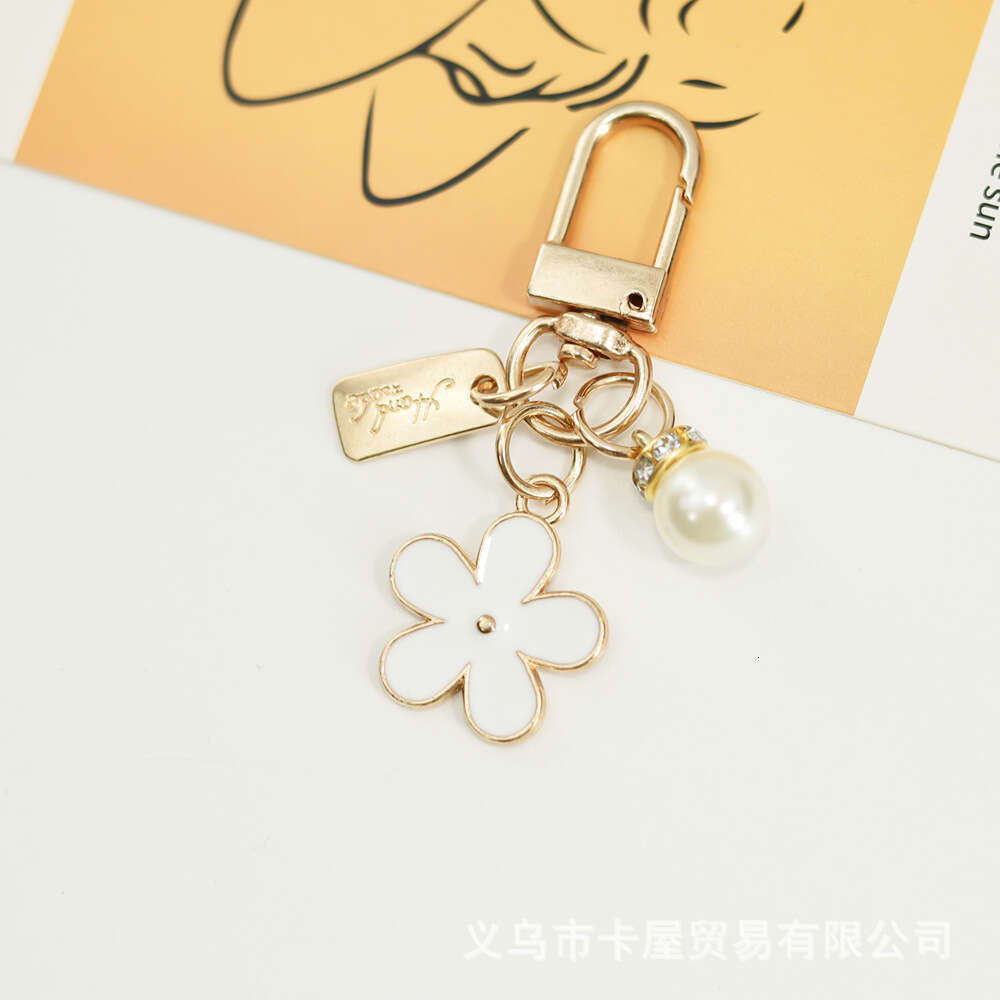 INS Metal Daisy Pearl Keychain Niche Flower Bluetooth Earphone Case Accessories