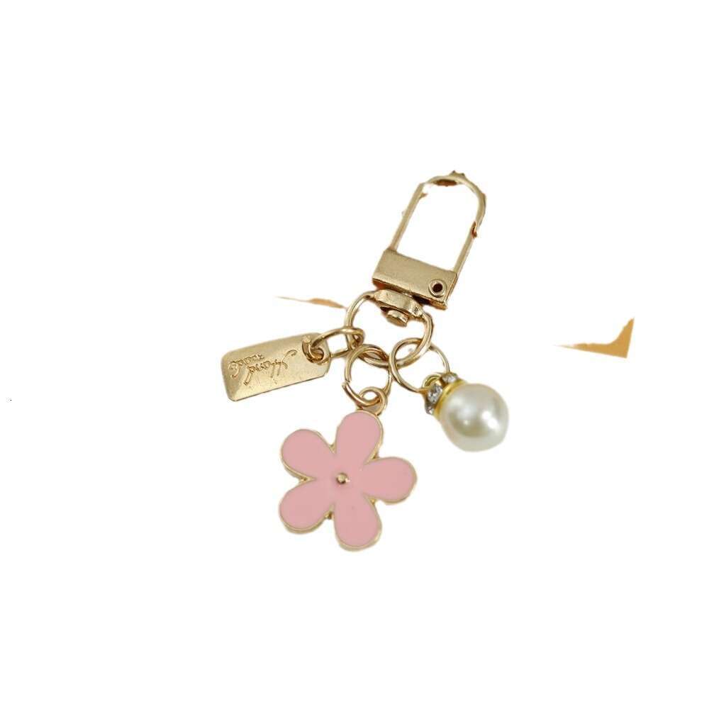 INS Metal Daisy Pearl Keychain Niche Flower Bluetooth Earphone Case Accessories