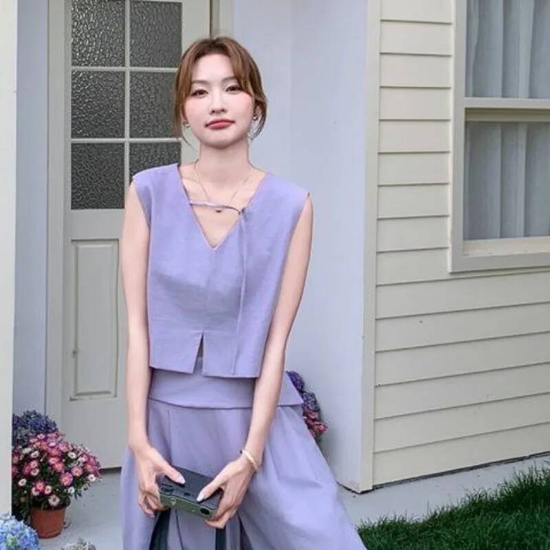 2025 summer fashion Korean hollow solid design color short sleeved top for women, featuring long pants and a two-piece designer top