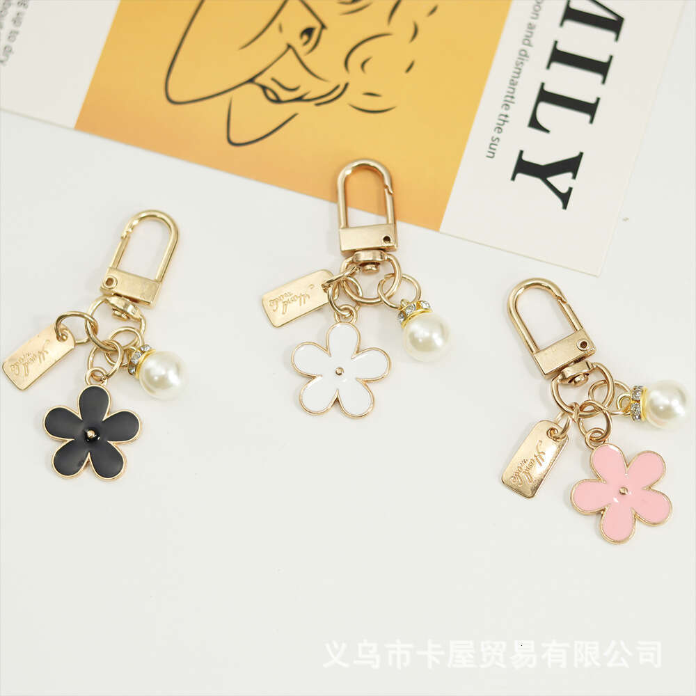 INS Metal Daisy Pearl Keychain Niche Flower Bluetooth Earphone Case Accessories