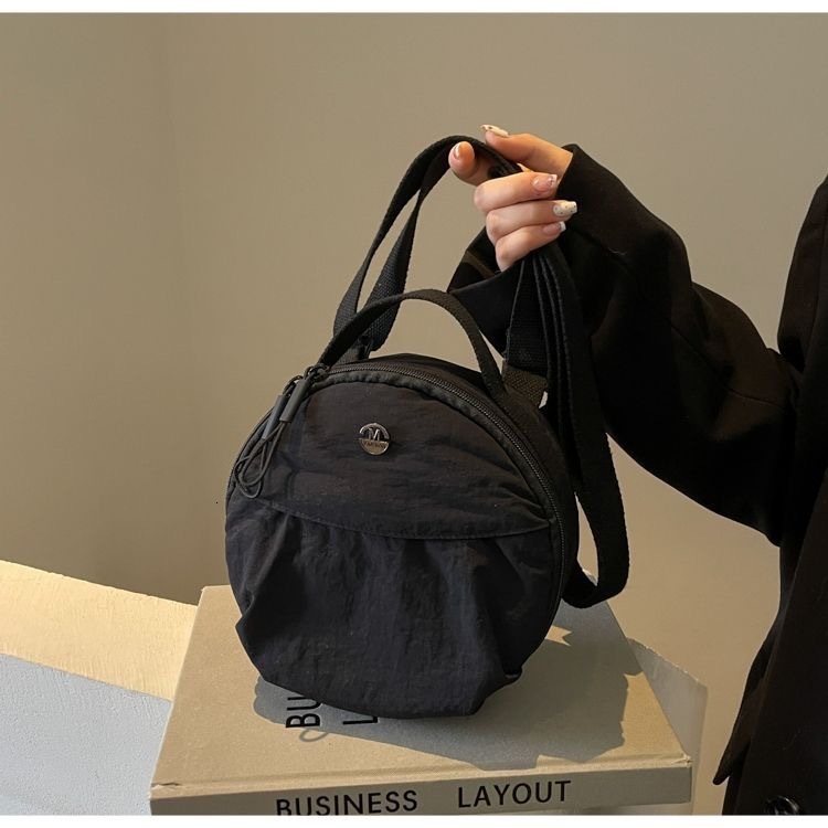 2025 new fashionable commuting canvas circular women's niche designer handbag crossbody bag