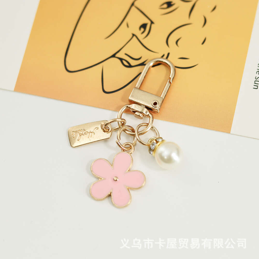 INS Metal Daisy Pearl Keychain Niche Flower Bluetooth Earphone Case Accessories