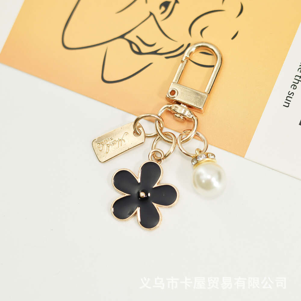 INS Metal Daisy Pearl Keychain Niche Flower Bluetooth Earphone Case Accessories