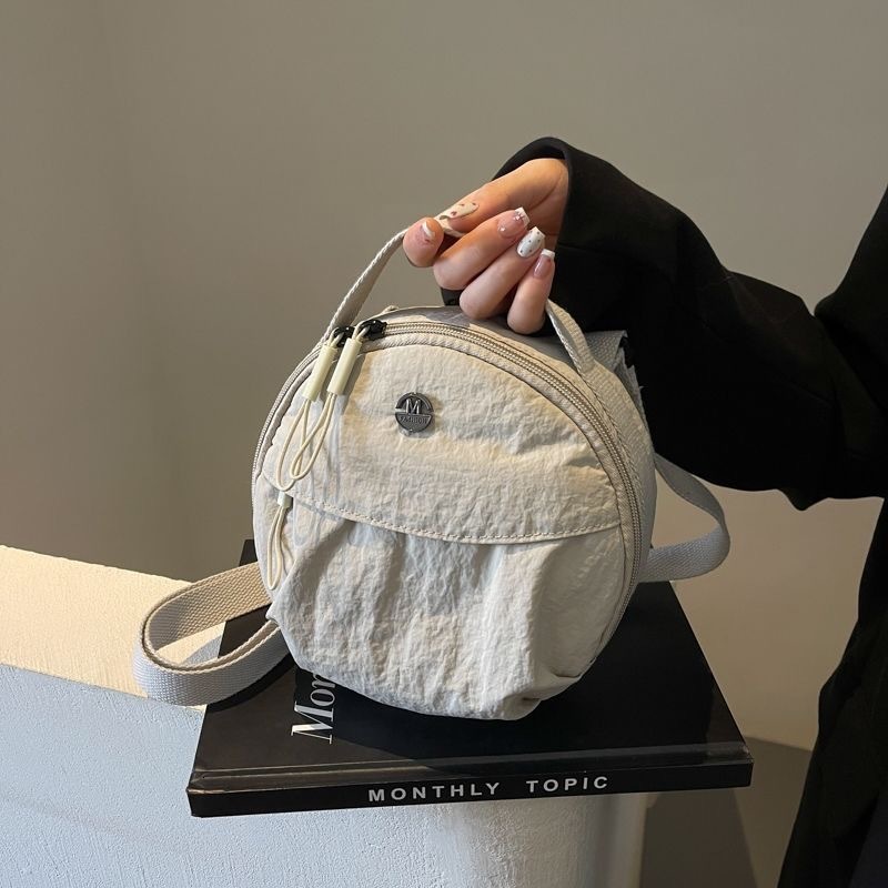 2025 new fashionable commuting canvas circular women's niche designer handbag crossbody bag