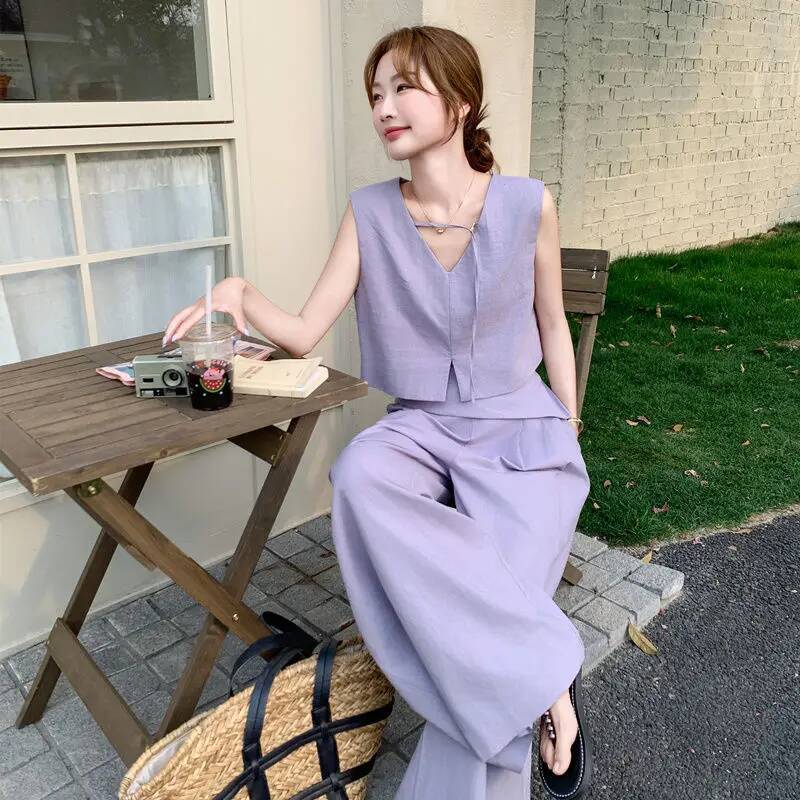 2025 summer fashion Korean hollow solid design color short sleeved top for women, featuring long pants and a two-piece designer top