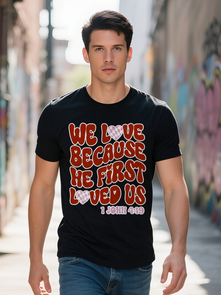Men s Crew Neck T Shirt We Because He First Loved Us John Print Black with Red Pink Lettering Checkered Heart
