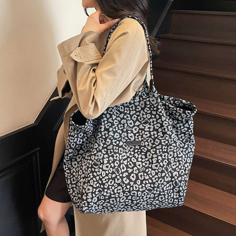 Niche Leopard Print Canvas for Women 2025 New Fashion Versatile Shoulder Large Capacity Tote Commuter Underarm Bag