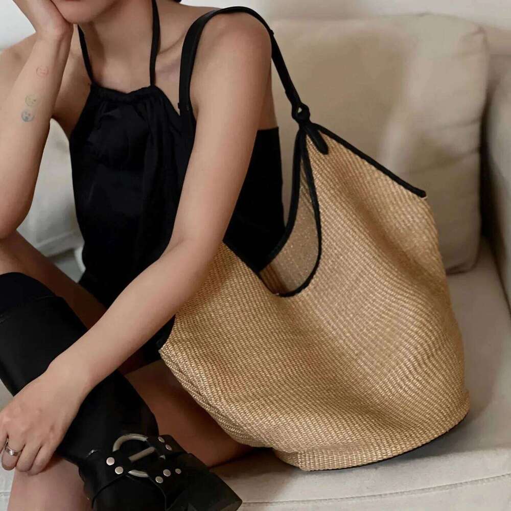 Lafite splicing head layer cowhide woven 2025 new niche design fashion summer vacation beach women underarm shoulder bag