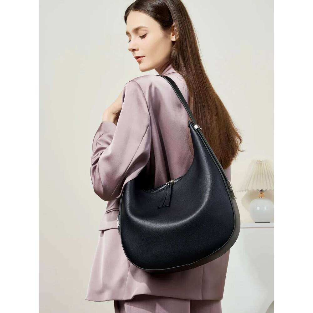 2025 spring/summer new niche design cowhide underarm shoulder hand-held leather crescent bucket women's bag