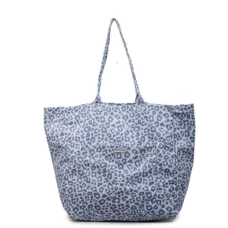 Niche Leopard Print Canvas for Women 2025 New Fashion Versatile Shoulder Large Capacity Tote Commuter Underarm Bag