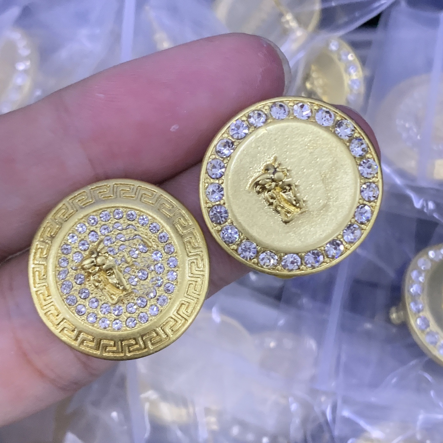 Retro diamond studded asymmetrical earrings with embossed human head and palace round earrings