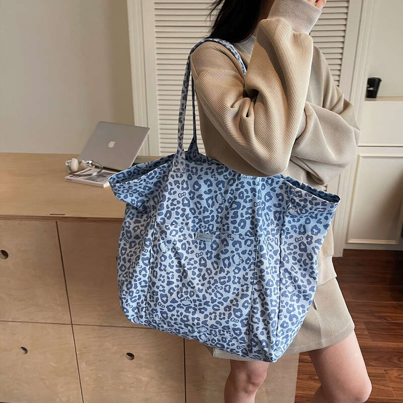 Niche Leopard Print Canvas for Women 2025 New Fashion Versatile Shoulder Large Capacity Tote Commuter Underarm Bag