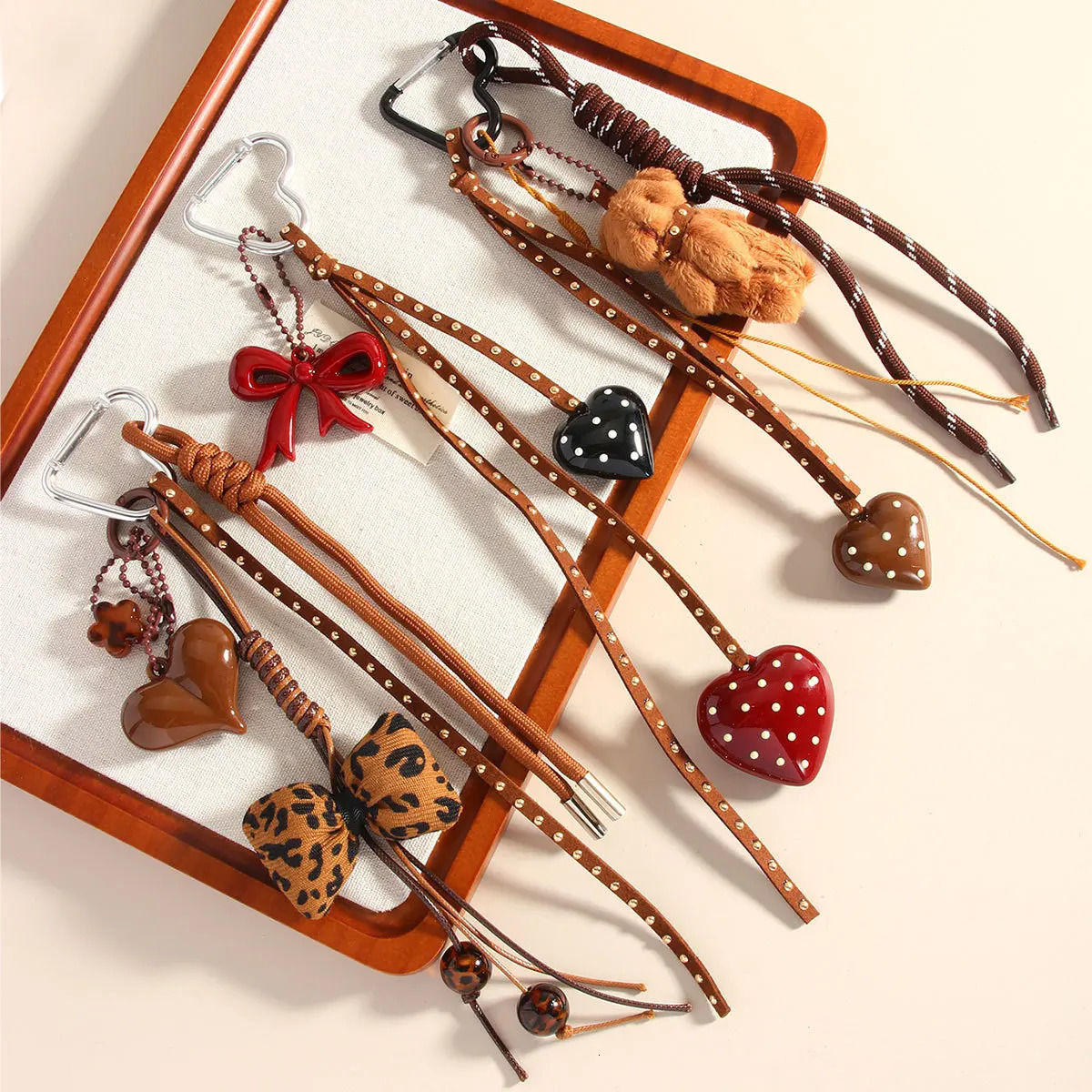 Series Handmade Leather Braid Rope Love Heart Button Key Chain Cute Spot Bow Bear Doll Bag Pendant Keychain for Women 250811