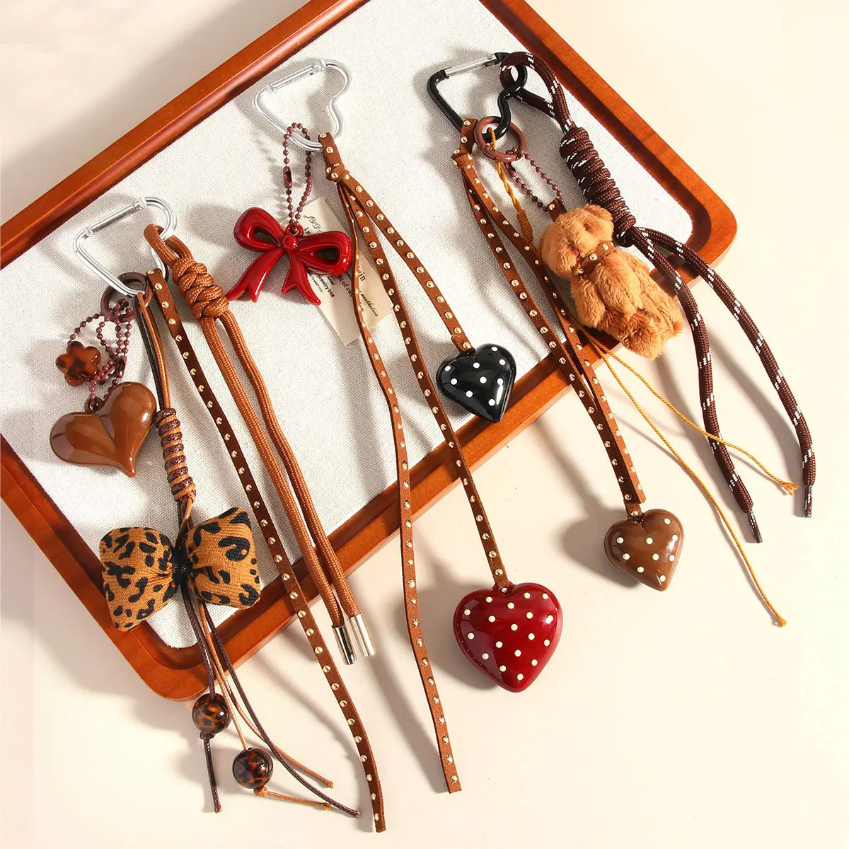 Series Handmade Leather Braid Rope Love Heart Button Key Chain Cute Spot Bow Bear Doll Bag Pendant Keychain for Women 250811