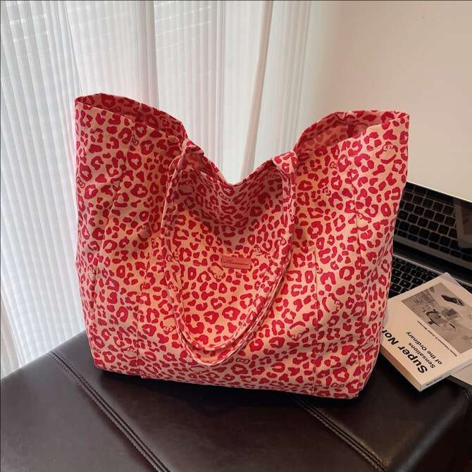 Niche Leopard Print Canvas for Women 2025 New Fashion Versatile Shoulder Large Capacity Tote Commuter Underarm Bag