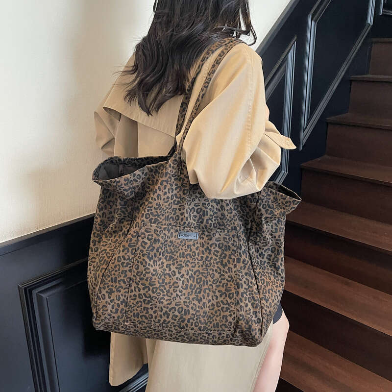 Niche Leopard Print Canvas for Women 2025 New Fashion Versatile Shoulder Large Capacity Tote Commuter Underarm Bag