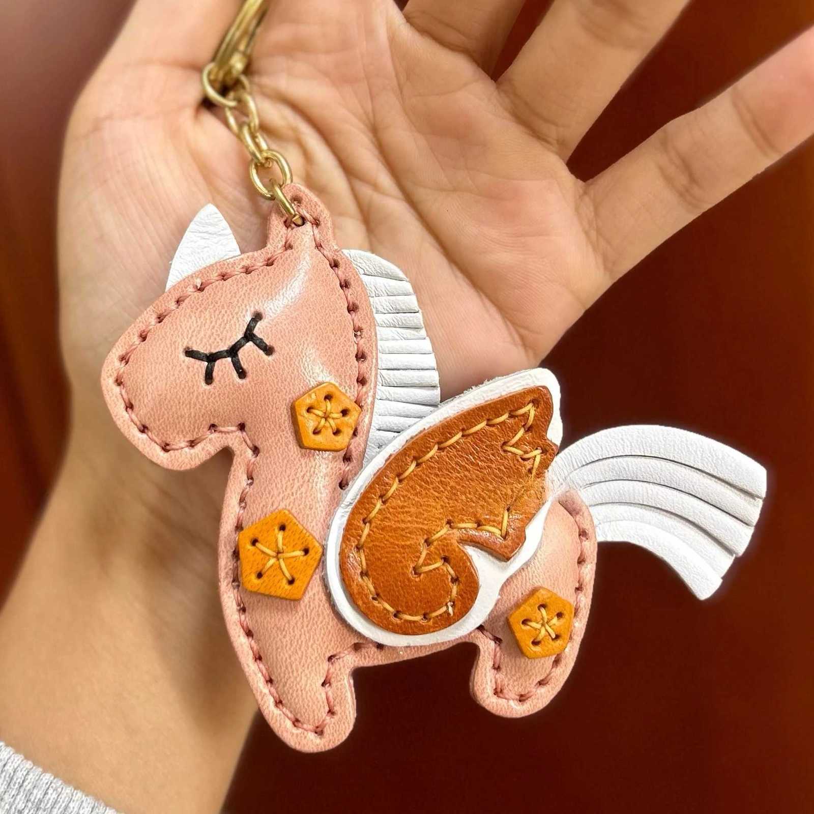 The top layer of cowhide hand-sewn unicorn pendant keychain pendant car keychain color block simulation decoration S250814