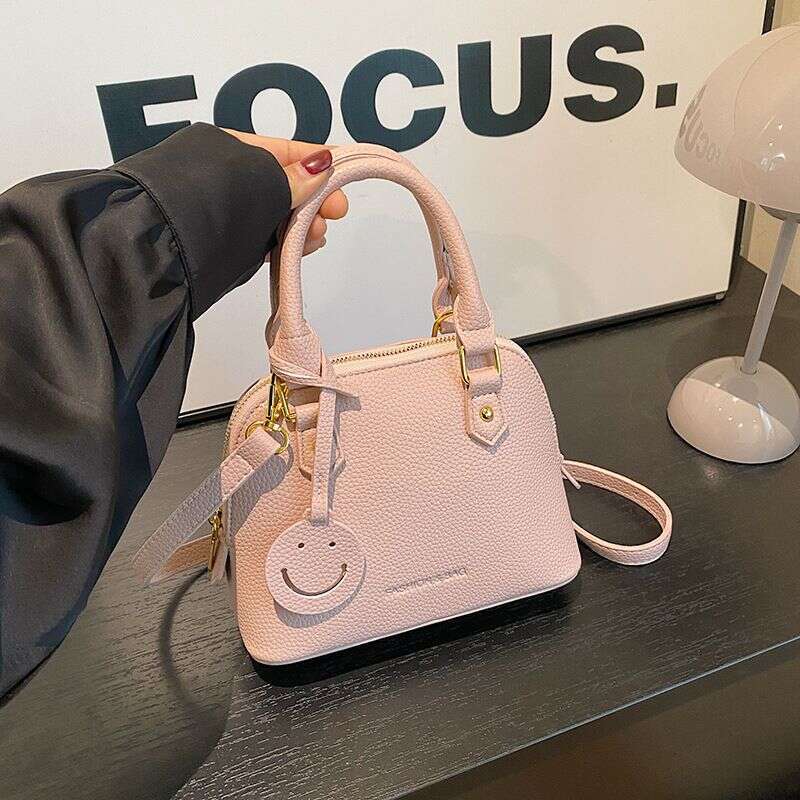 Trendy temperament solid color hand-held shell 2024 new high-end multi-color single shoulder crossbody women's bag