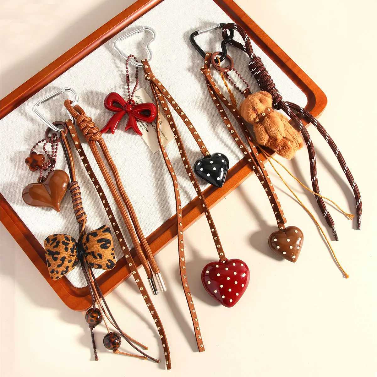 New Series Handmade Leather Braided Rope Love Heart Button Keychain Cute Spot Bow Bear Doll Bag Pendant Keychain for Women Y250815