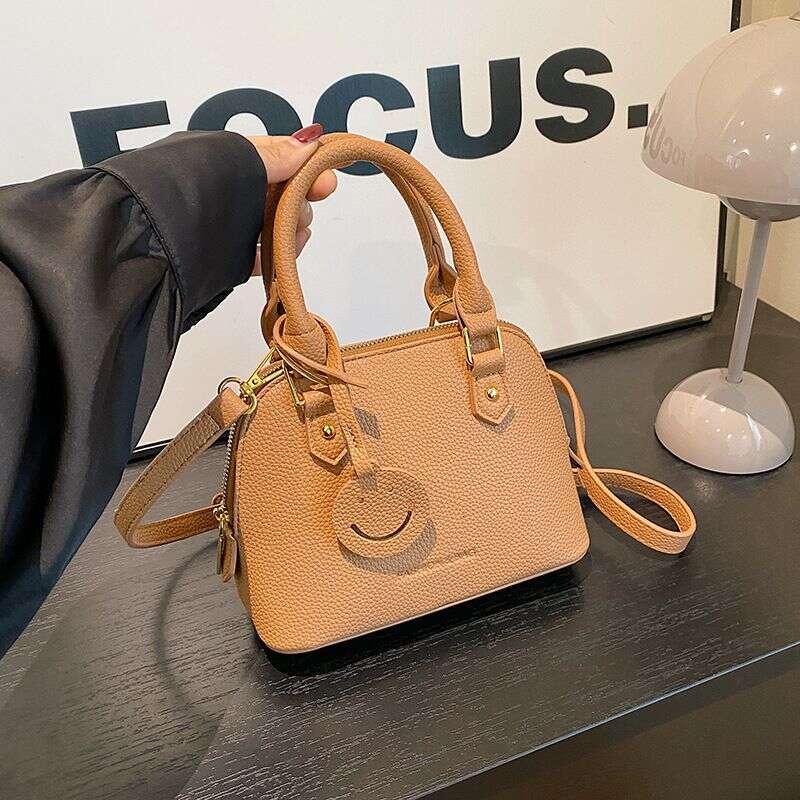 Trendy temperament solid color hand-held shell 2024 new high-end multi-color single shoulder crossbody women's bag