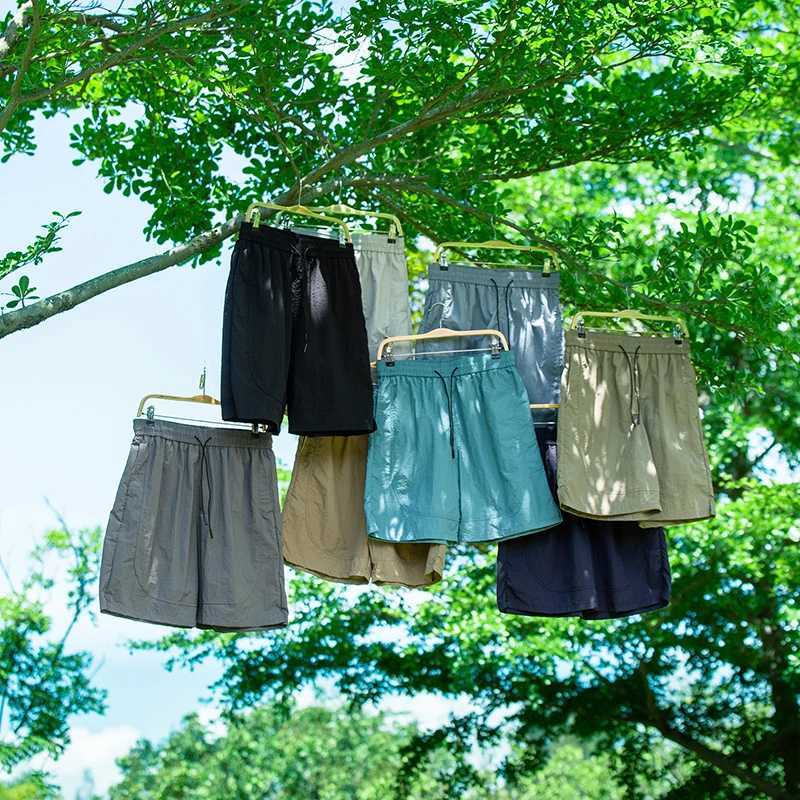 Ice silk waterproof quick drying shorts mens summer thin fit loose cycling running tennis versatile sports five quarter pants Y250814