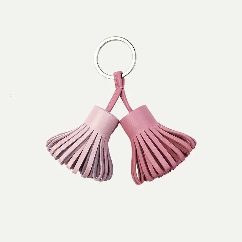 2025 New Luxury Genuine Leather Sheepskin Two-Color Grass Skirt Bag Pendant Key Ring Mens Handbag Tassel Hanging Decoration Y250815