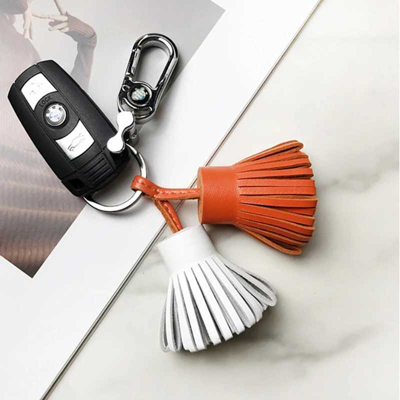 2025 New Luxury Genuine Leather Sheepskin Two-Color Grass Skirt Bag Pendant Key Ring Mens Handbag Tassel Hanging Decoration Y250815