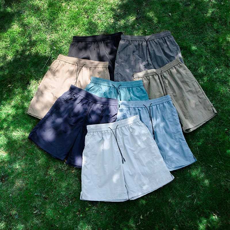 Ice silk waterproof quick drying shorts mens summer thin fit loose cycling running tennis versatile sports five quarter pants Y250814