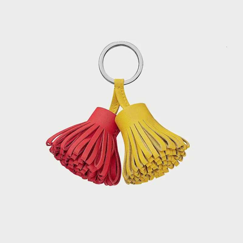 2025 New Luxury Genuine Leather Sheepskin Two-Color Grass Skirt Bag Pendant Key Ring Mens Handbag Tassel Hanging Decoration Y250815