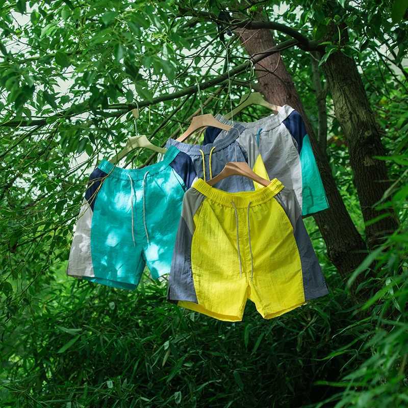 Sports running shorts mens trendy brand color blocking splicing drawstring elastic five quarter pants for men and women Y250814