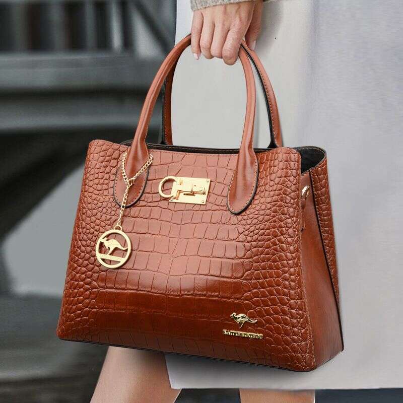 Crocodile print 2023 new one-shoulder cross-body hand-held middle-aged mom counter women's bag